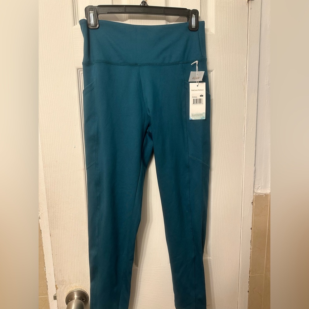 Deep aqua leggings with pockets. NWT. Size L